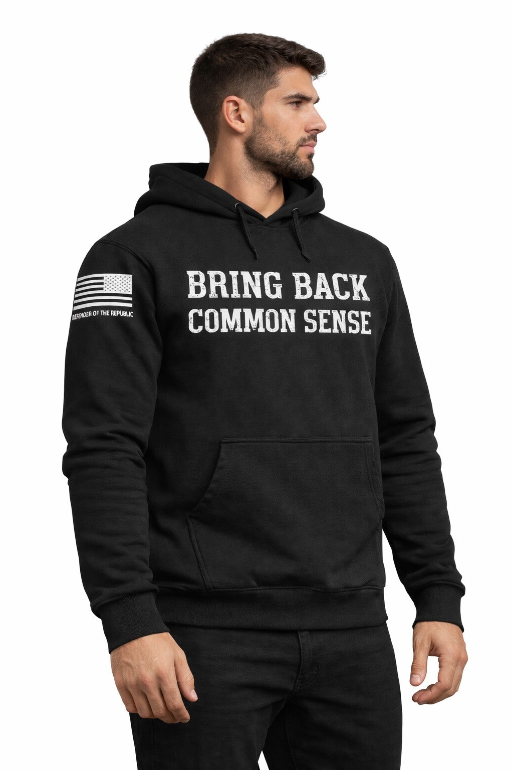 Man wearing a black hoodie with 'Bring Back Common Sense' white text on the front and a white American flag on right sleeve with small text reading Defender of the Republic' - entire picture on a black background